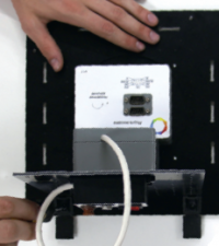 Inserting the side plate into the slots of the base plate